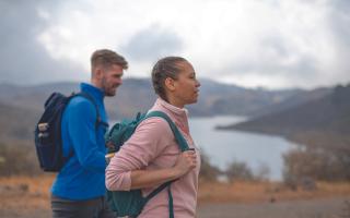 A man and a woman hiking. Credit: Craghoppers