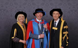 Dougie Scarfe OBE (centre) with the University of Exeter’s President and Vice-Chancellor, Professor Lisa Roberts, and Chancellor, Sir Michael Barber