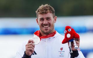 Great Britain's Jack Eyers on the podium with the silver medal after the Men's Va'a Single 200m - VL3 Final at the Vaires-sur-Marne Stadium on day eleven of the Paris 2024 Summer Paralympic Games.