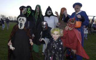 Christchurch Bonfire and Fireworks Display at Stanpit Recreation Ground. Pic: Keeping it in the family; dressed in Halloween Fancy Dress are the Moxham, Message and Foch Families, from Christchurch.