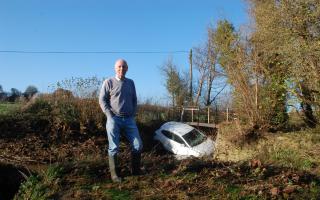 Dr Leslie Spiers helped rescue a woman from the river outisde his home after her car became trapped in floodwater