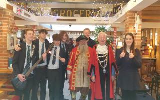 Pupils from QE School along with the town mayor, Cllr Jeff Hart and town crier, Chris Brown