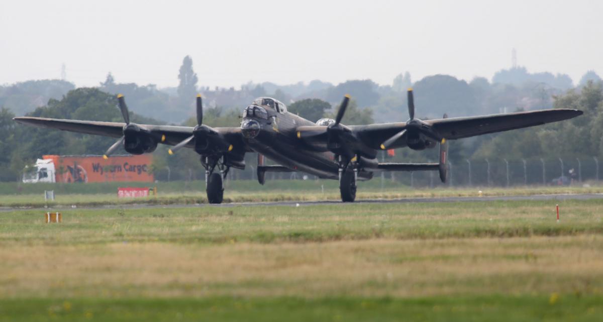 The world's two airworthy Lancasters fly in to Bournemouth Airport. Photos by Richard Crease. 