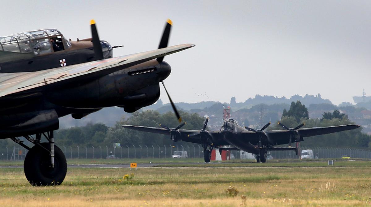 The world's two airworthy Lancasters fly in to Bournemouth Airport. Photos by Richard Crease. 