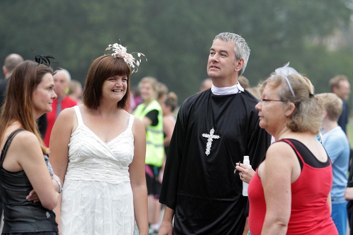 Keen runners Eve Carter and Graham Filmer tie the knot during the Poole parkrun. Photos by Sally Adams. 