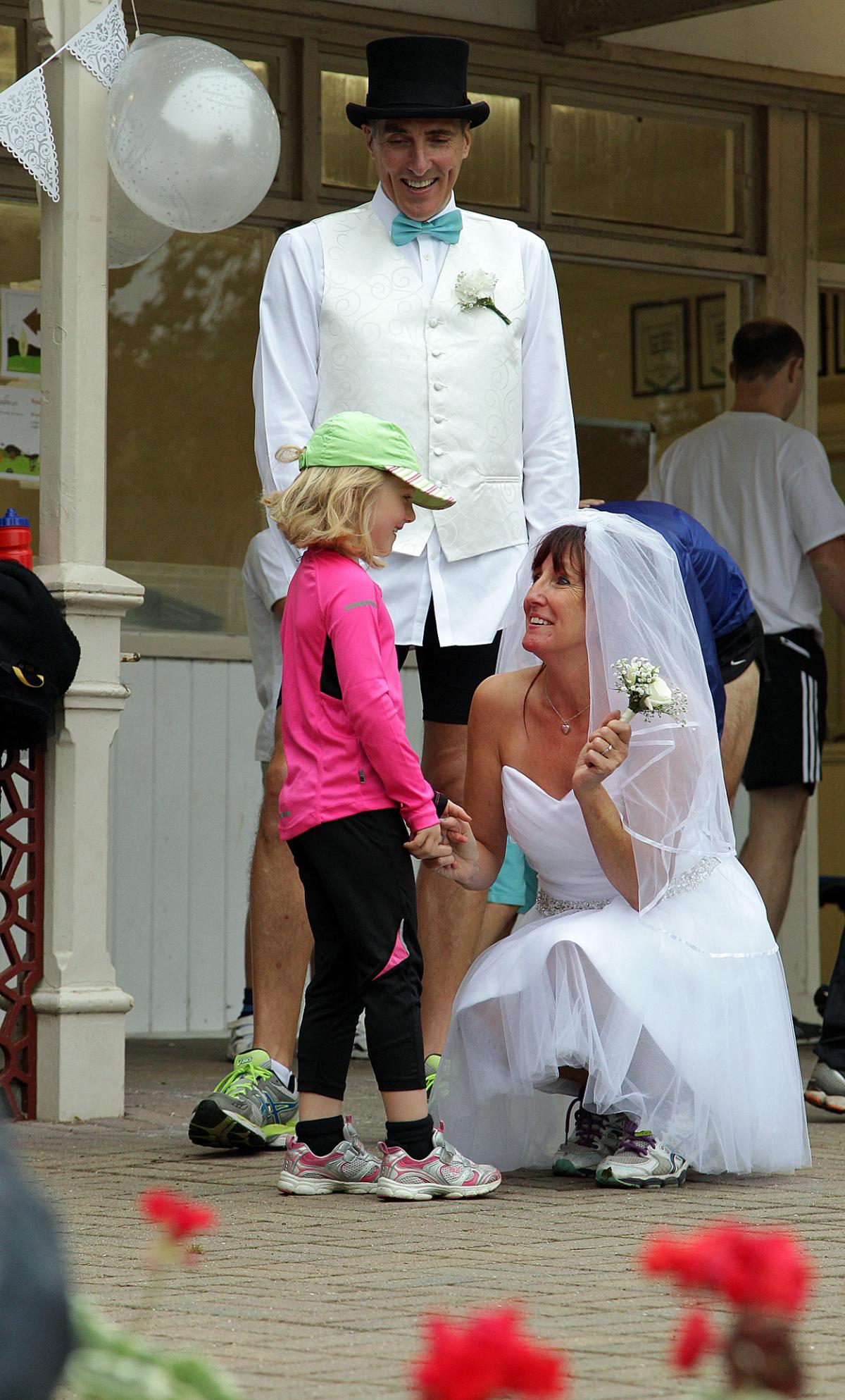 Keen runners Eve Carter and Graham Filmer tie the knot during the Poole parkrun. Photos by Sally Adams. 