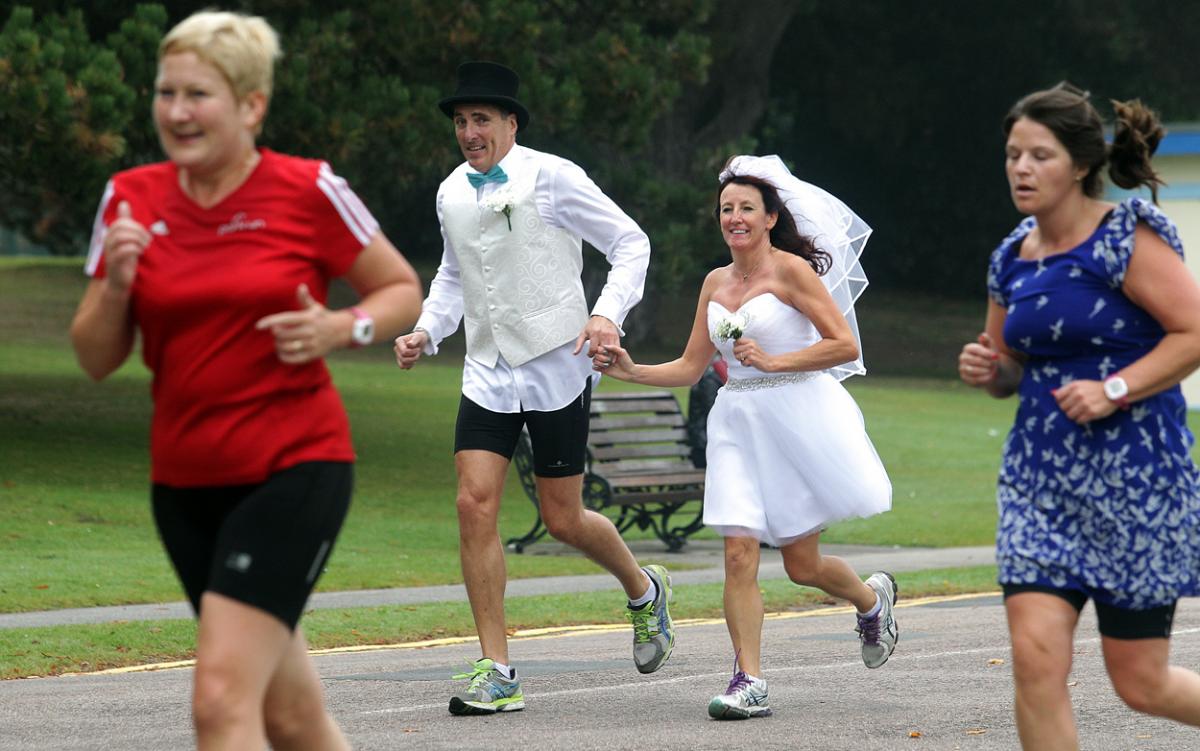 Keen runners Eve Carter and Graham Filmer tie the knot during the Poole parkrun. Photos by Sally Adams. 