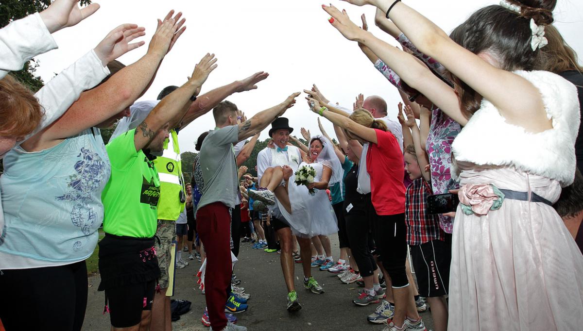 Keen runners Eve Carter and Graham Filmer tie the knot during the Poole parkrun. Photos by Sally Adams. 