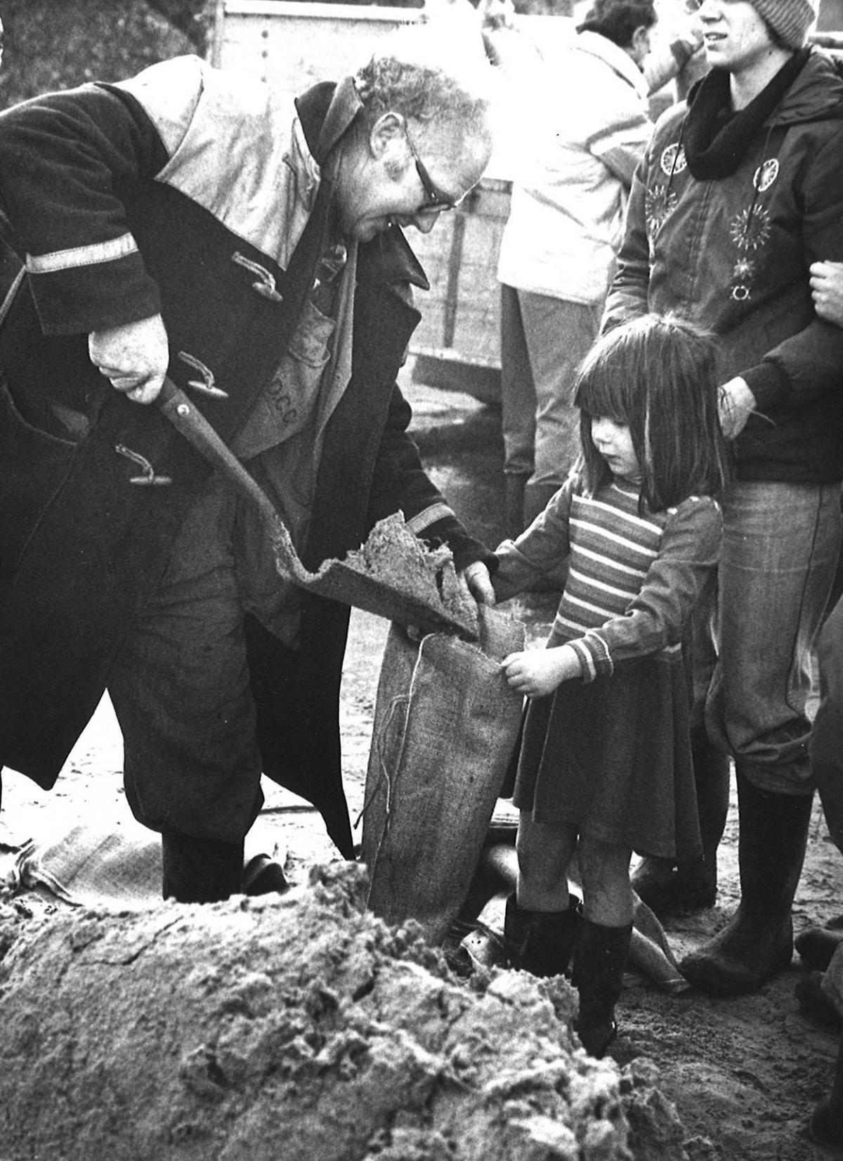 Residents at Sturminster Marshall  prepared sandbags to protect homes in the village from the flood waters of the 1979 storm. 
