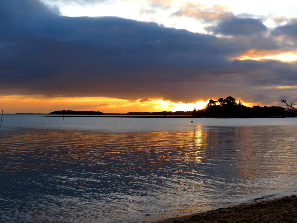 Sunrise over Long island  in Poole harbour taken by Simon Gregory