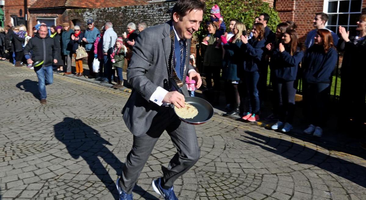 Pancake Day races take place in Christchurch on Shrove Tuesday. Pictures by Sally Adams.