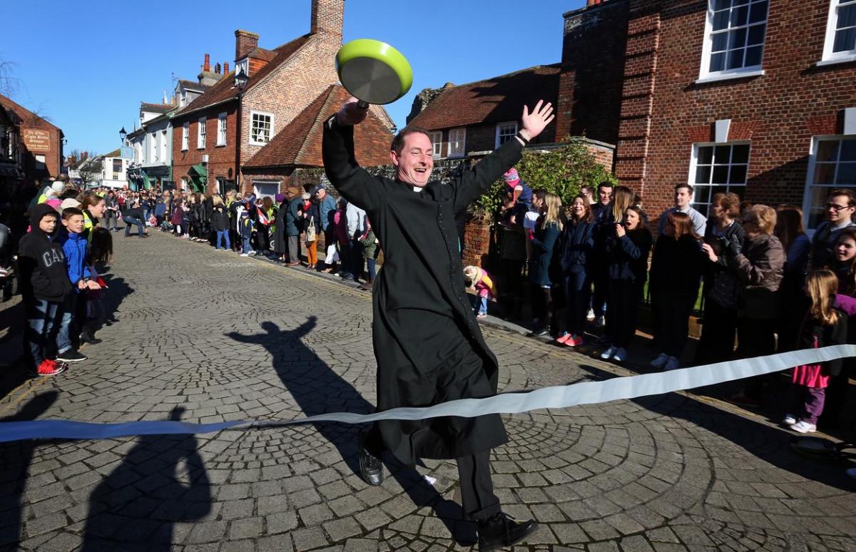 Pancake Day races take place in Christchurch on Shrove Tuesday. Pictures by Sally Adams.