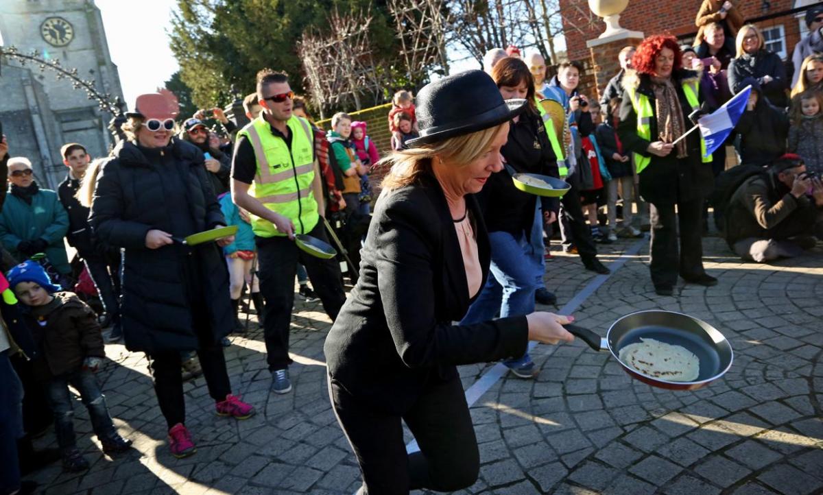 Pancake Day races take place in Christchurch on Shrove Tuesday. Pictures by Sally Adams.