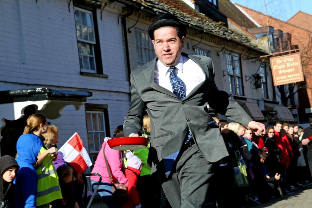 Pancake Day races take place in Christchurch on Shrove Tuesday. Pictures by Sally Adams.