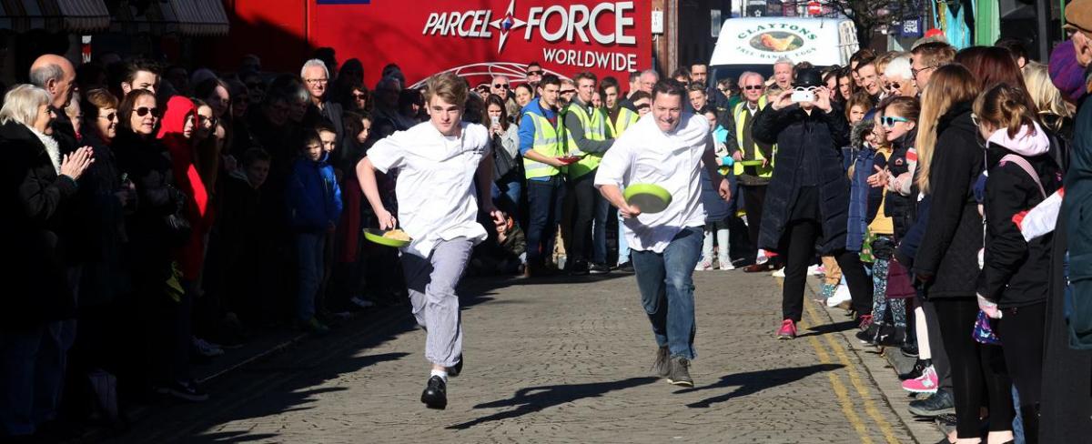 Pancake Day races take place in Christchurch on Shrove Tuesday. Pictures by Sally Adams.