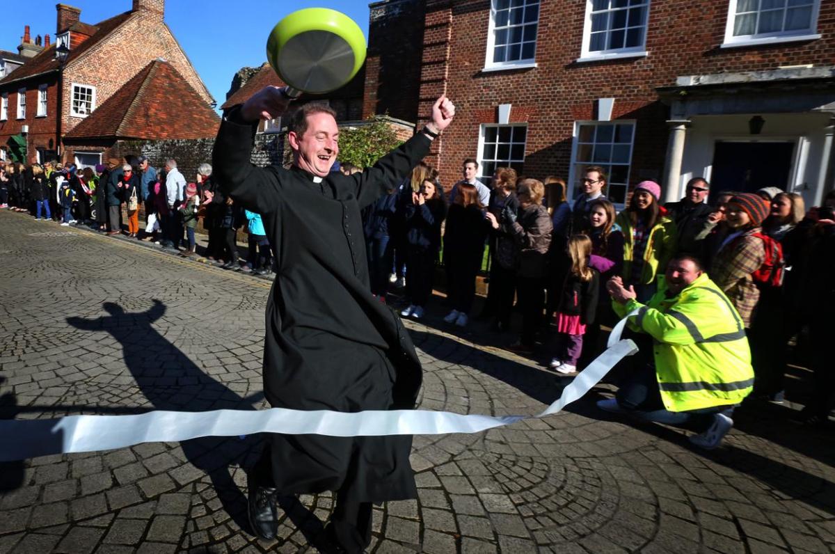 Pancake Day races take place in Christchurch on Shrove Tuesday. Pictures by Sally Adams.