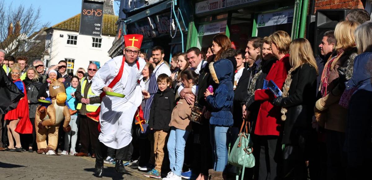 Pancake Day races take place in Christchurch on Shrove Tuesday. Pictures by Sally Adams.