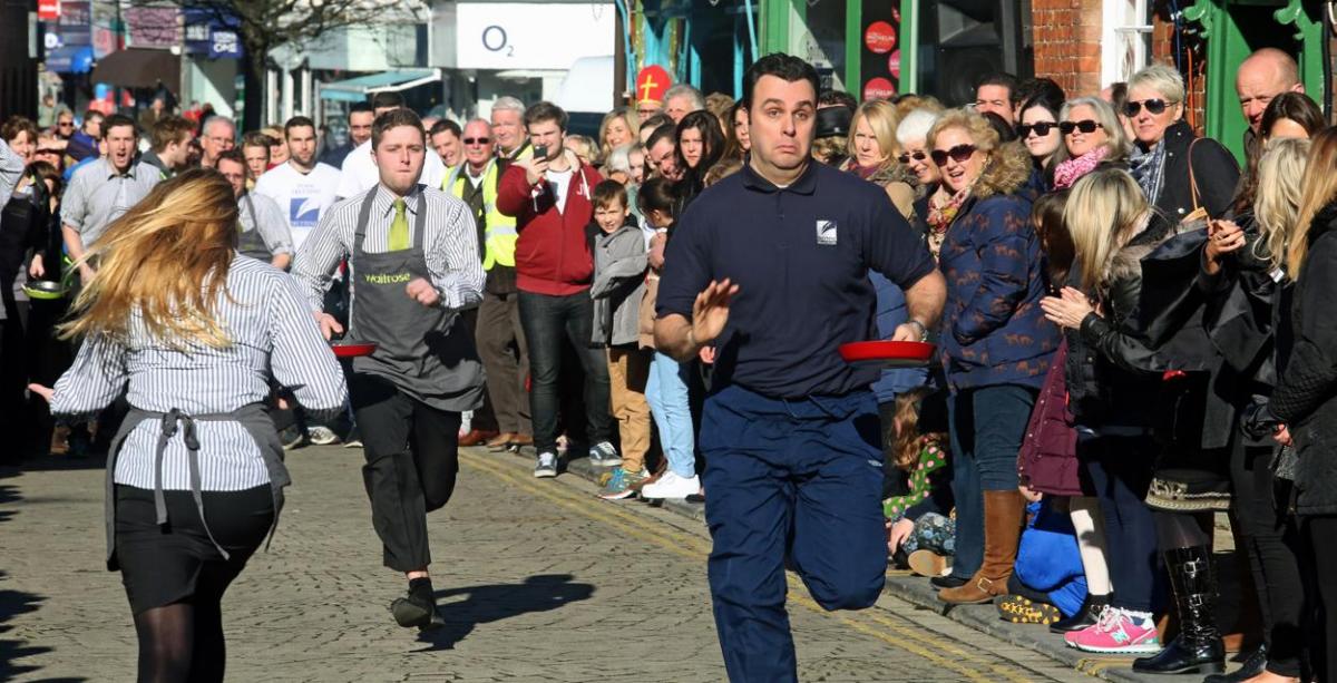 Pancake Day races take place in Christchurch on Shrove Tuesday. Pictures by Sally Adams.