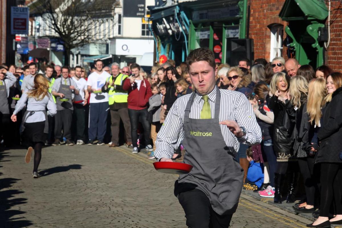 Pancake Day races take place in Christchurch on Shrove Tuesday. Pictures by Sally Adams.