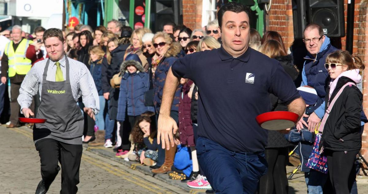 Pancake Day races take place in Christchurch on Shrove Tuesday. Pictures by Sally Adams.