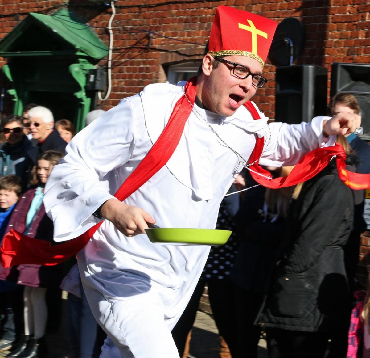 Pancake Day races take place in Christchurch on Shrove Tuesday. Pictures by Sally Adams.