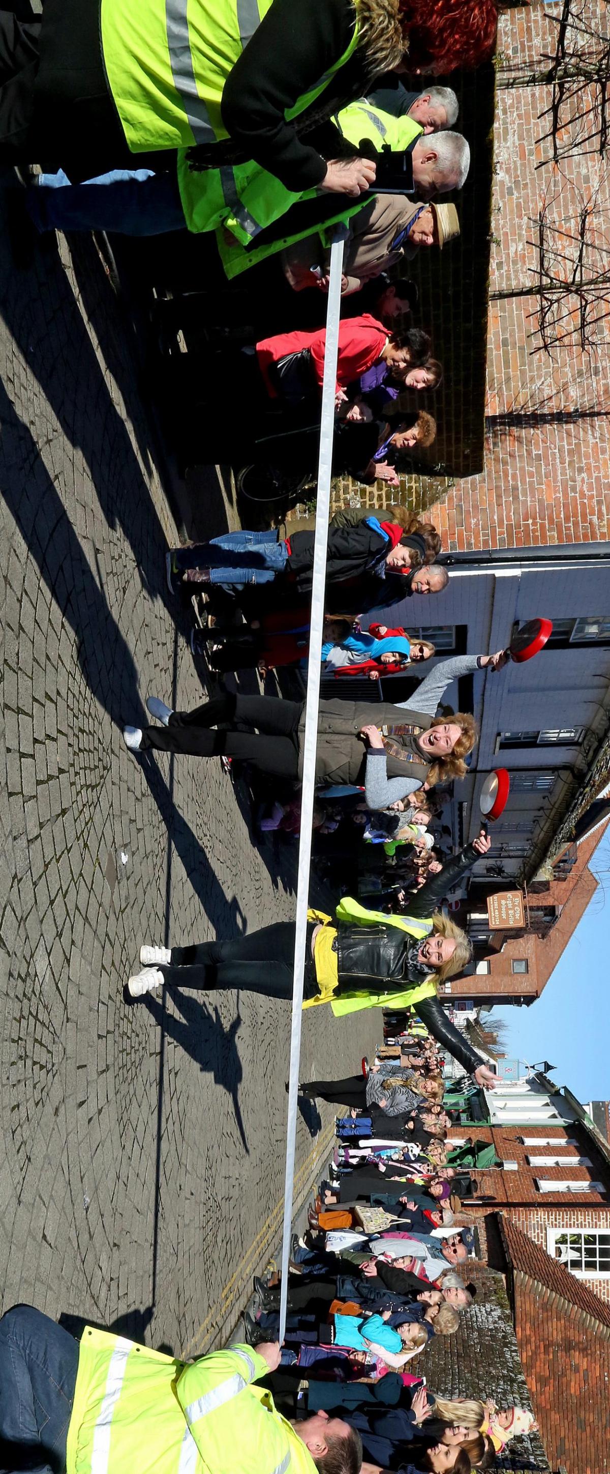 Pancake Day races take place in Christchurch on Shrove Tuesday. Pictures by Sally Adams.