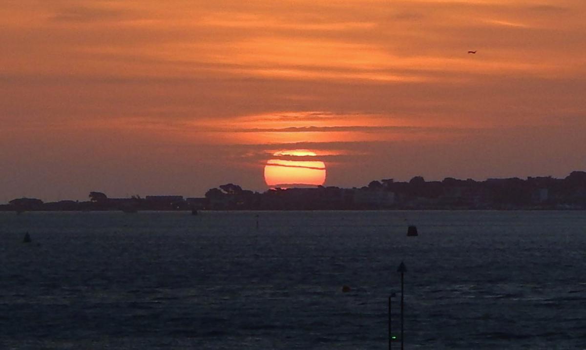 Sunrise over  sandbanks  taken by Pete Elsdon of Wareham